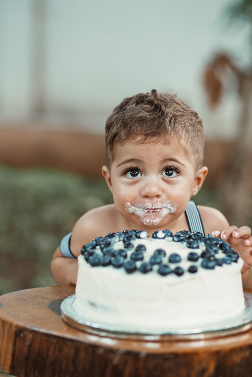 cute child eating cake